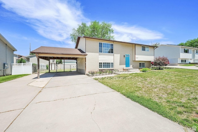 2652 W 6050 S, Roy, UT 84067 - bi-level home featuring an attached carport and driveway