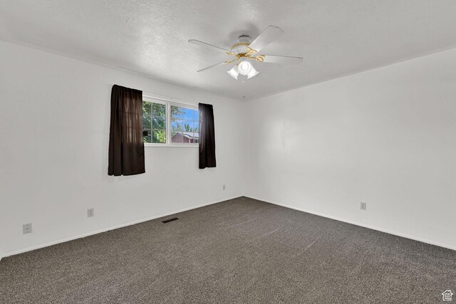 2652 W 6050 S, Roy, UT 84067 - empty room featuring ceiling fan, dark colored carpet, baseboards, and a textured ceiling