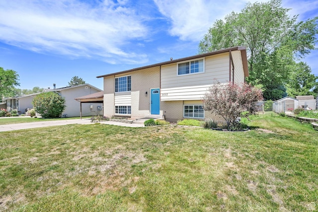 2652 W 6050 S, Roy, UT 84067 - raised ranch with brick siding, a front lawn, and concrete driveway
