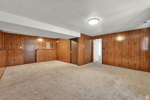 2652 W 6050 S, Roy, UT 84067 - spare room with a textured ceiling, wooden walls, and carpet flooring