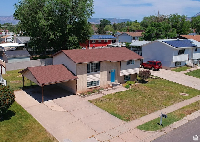 2652 W 6050 S, Roy, UT 84067 - view of front of home with driveway, a carport, a residential view, and a mountain view