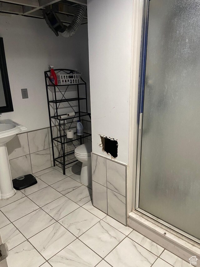 7162 S 2180 W, West Jordan, UT 84084 - full bathroom with marble look tiles, a shower stall, and toilet