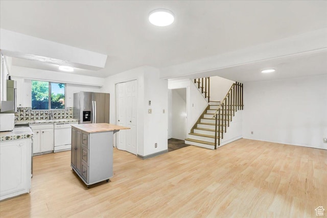 5424 S 850 E, South Ogden, UT 84405 - kitchen featuring stainless steel refrigerator with ice dispenser, dishwasher, a center island, and light wood finished floors