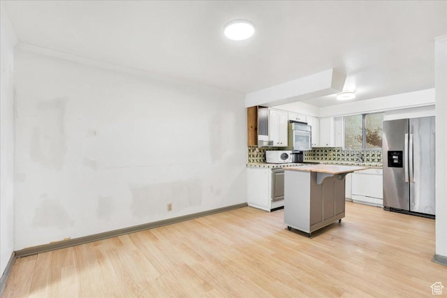5424 S 850 E, South Ogden, UT 84405 - kitchen featuring white appliances, light countertops, light wood-type flooring, and backsplash