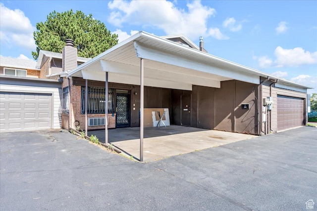 5424 S 850 E, South Ogden, UT 84405 - view of front of house with brick siding and a garage