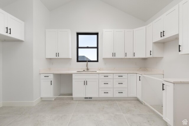 6552 W Timber Ranch Dr, Herriman, UT 84096 - kitchen with a sink, lofted ceiling, white cabinets, and light countertops