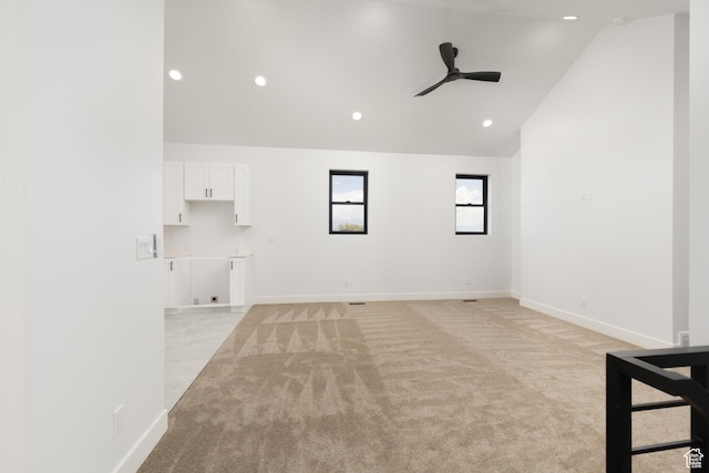 6552 W Timber Ranch Dr, Herriman, UT 84096 - unfurnished living room featuring a ceiling fan, light carpet, recessed lighting, baseboards, and high vaulted ceiling