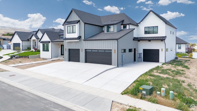 6552 W Timber Ranch Dr, Herriman, UT 84096 - modern farmhouse style home featuring a standing seam roof, a garage, metal roof, driveway, and a shingled roof