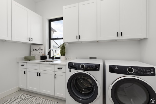 6552 W Timber Ranch Dr, Herriman, UT 84096 - laundry room featuring separate washer and dryer, cabinet space, and baseboards