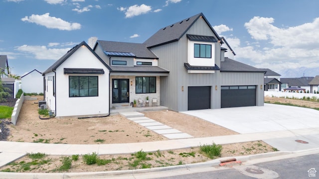 6552 W Timber Ranch Dr, Herriman, UT 84096 - modern inspired farmhouse featuring a standing seam roof, driveway, an attached garage, metal roof, and board and batten siding