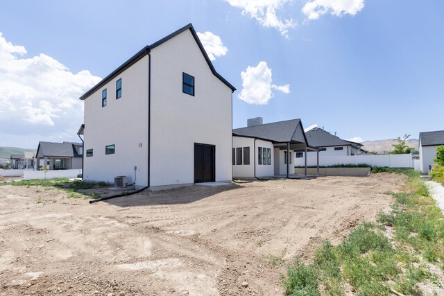 6552 W Timber Ranch Dr, Herriman, UT 84096 - rear view of property with stucco siding and central AC unit