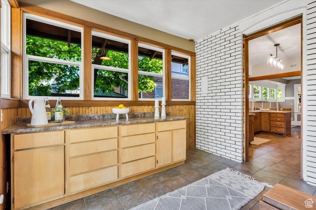 457 S Douglas St E, Salt Lake City, UT 84102 - kitchen with light brown cabinets and wood walls