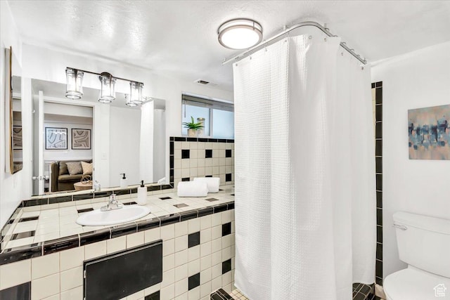 457 S Douglas St E, Salt Lake City, UT 84102 - full bathroom with toilet, vanity, and curtained shower