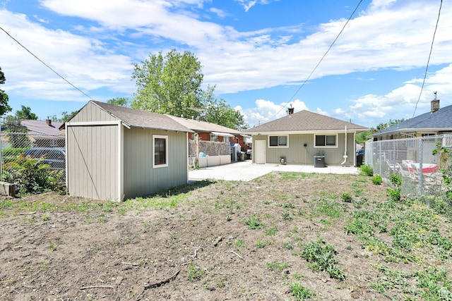 2654 Brinker Ave, Ogden, UT 84401 - back of property featuring a fenced backyard, a patio, and cooling unit