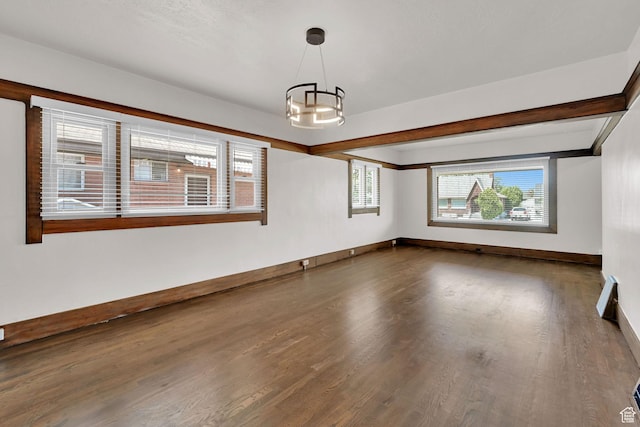 2654 Brinker Ave, Ogden, UT 84401 - unfurnished room featuring wood finished floors, a chandelier, and baseboards