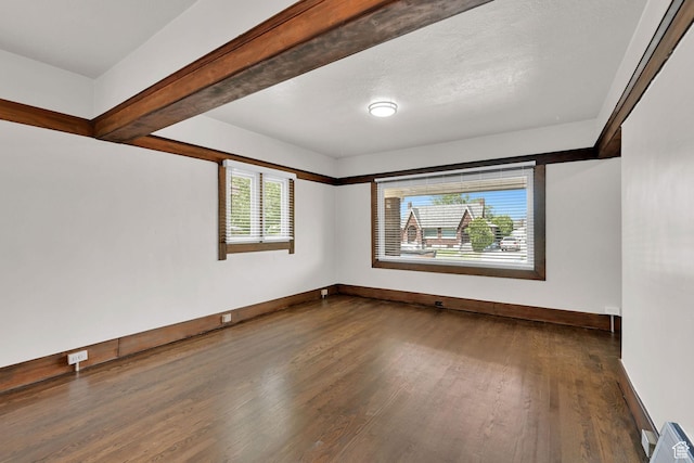 2654 Brinker Ave, Ogden, UT 84401 - empty room with dark wood finished floors and baseboards