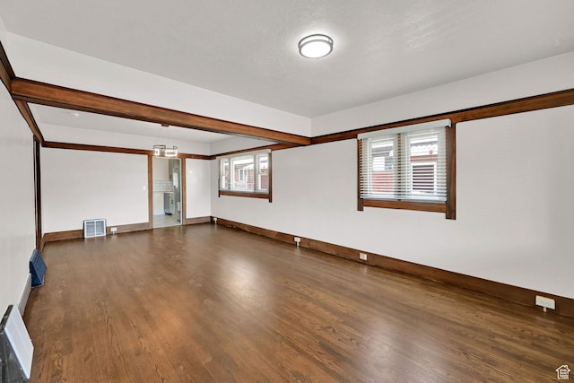 2654 Brinker Ave, Ogden, UT 84401 - unfurnished living room with dark wood finished floors and baseboards