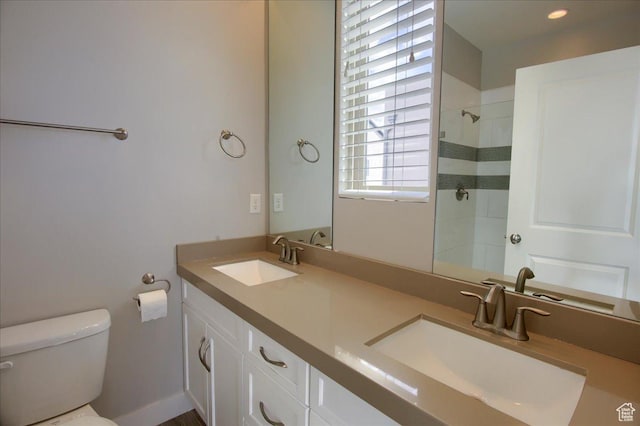 4508 W Kestrel Ridge Rd, South Jordan, UT 84009 - bathroom with toilet, double vanity, and a tile shower