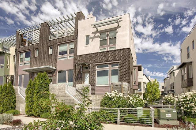 4508 W Kestrel Ridge Rd, South Jordan, UT 84009 - view of front of house with brick siding, stucco siding, and a residential view