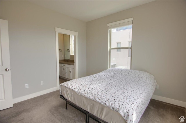 4508 W Kestrel Ridge Rd, South Jordan, UT 84009 - bedroom with baseboards, dark carpet, and ensuite bath