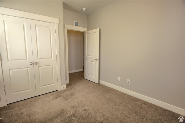 4508 W Kestrel Ridge Rd, South Jordan, UT 84009 - unfurnished bedroom with light colored carpet, baseboards, and a closet