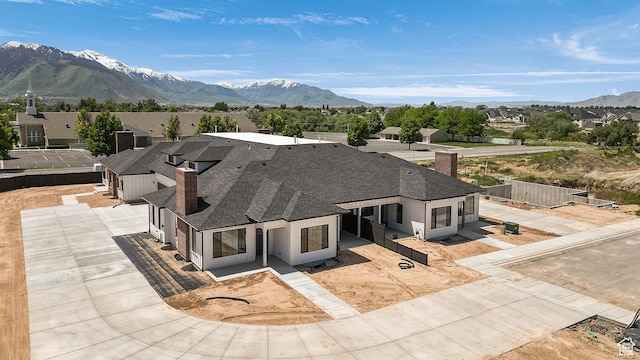 1631 W Century Ln Unit B, Mapleton, UT 84664 - view of front of house featuring a chimney, a mountain view, a shingled roof, a residential view, and a garage