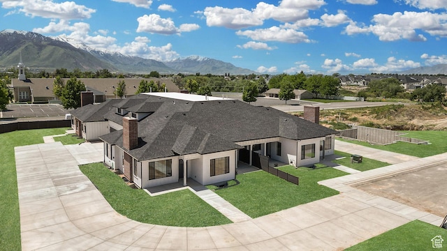 1631 W Century Ln Unit B, Mapleton, UT 84664 - view of front of home with a chimney, a residential view, a shingled roof, and a mountain view