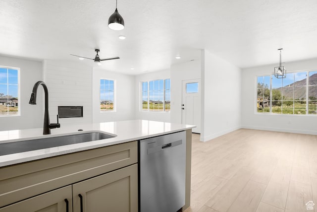 1631 W Century Ln Unit B, Mapleton, UT 84664 - kitchen featuring dishwasher, a sink, gray cabinetry, light countertops, and decorative light fixtures