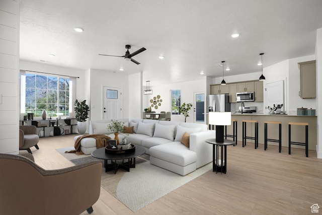 1631 W Century Ln Unit B, Mapleton, UT 84664 - living area with light wood finished floors, ceiling fan, recessed lighting, and a textured ceiling