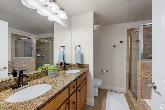 5519 Lillehammer Ln Unit 1307, Park City, UT 84098 - bathroom featuring a shower stall, toilet, tile patterned floors, and double vanity