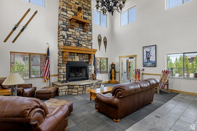 5519 Lillehammer Ln Unit 1307, Park City, UT 84098 - living room with a high ceiling, a chandelier, a stone fireplace, and baseboards