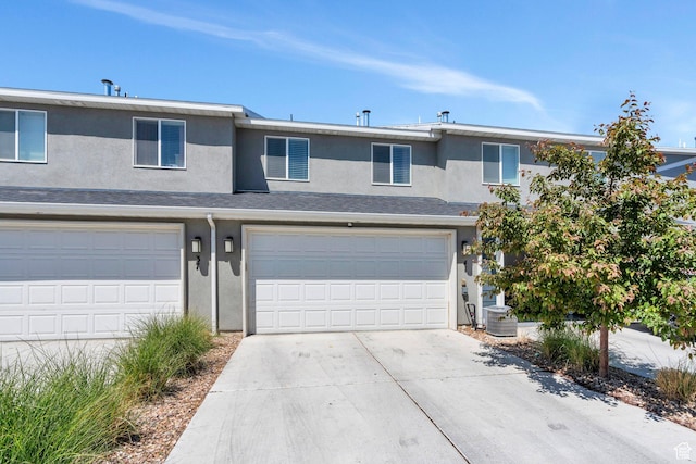 41 N Voyager Ln, Saratoga Springs, UT 84045 - view of front facade featuring stucco siding, a garage, and concrete driveway