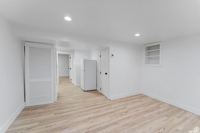 1167 29th St, Ogden, UT 84403 - empty room featuring baseboards, light wood finished floors, recessed lighting, and built in features