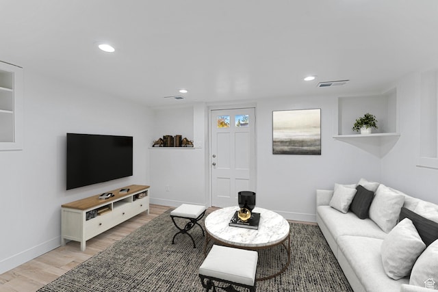 1167 29th St, Ogden, UT 84403 - living room featuring light wood-style flooring, baseboards, and recessed lighting