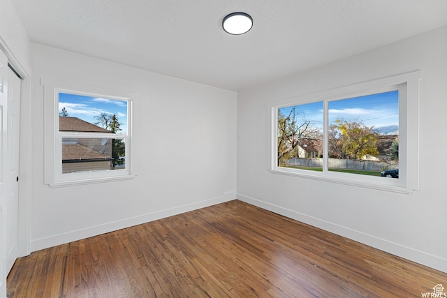 1167 29th St, Ogden, UT 84403 - unfurnished bedroom featuring baseboards, wood finished floors, and a closet