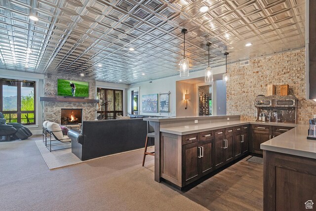 3428 Westview Trl, Park City, UT 84098 - kitchen featuring an ornate ceiling, light countertops, dark brown cabinets, open floor plan, and brick wall