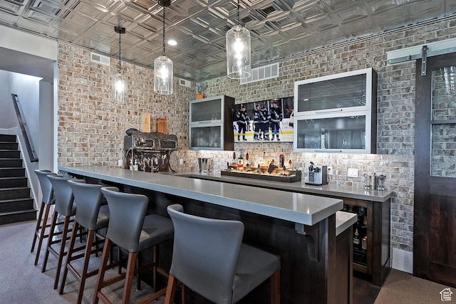 3428 Westview Trl, Park City, UT 84098 - indoor wet bar with an ornate ceiling, brick wall, stairs, and decorative light fixtures