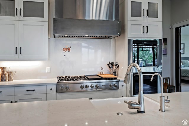3428 Westview Trl, Park City, UT 84098 - kitchen with ventilation hood, stainless steel appliances, white cabinetry, glass insert cabinets, and a sink