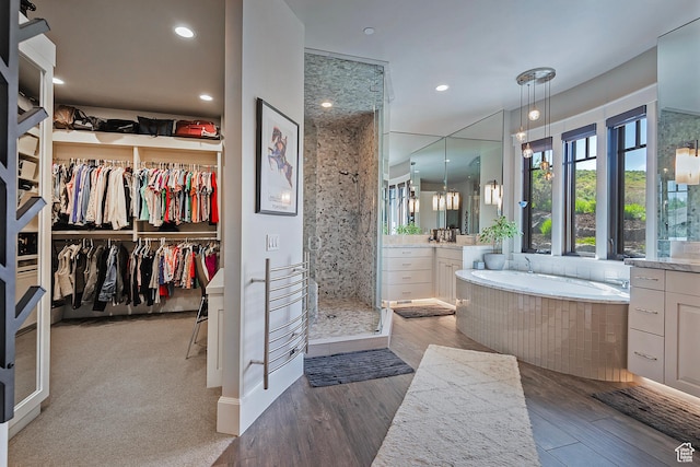 3428 Westview Trl, Park City, UT 84098 - full bathroom with vanity, a shower stall, a bath, wood finished floors, and recessed lighting