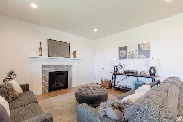 611 E 400 N, Providence, UT 84332 - living room with wood finished floors, recessed lighting, and a fireplace