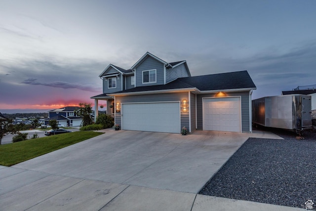611 E 400 N, Providence, UT 84332 - view of front of property featuring concrete driveway, an attached garage, and a front yard