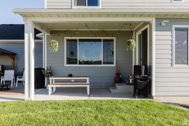 611 E 400 N, Providence, UT 84332 - entrance to property featuring a patio area and a yard