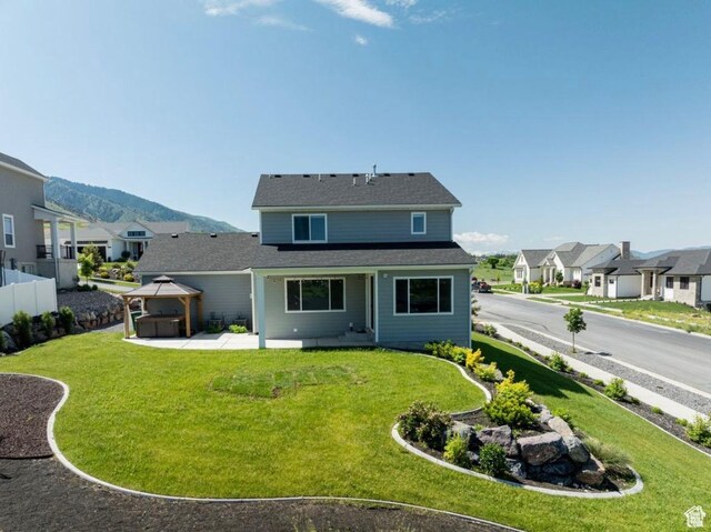 611 E 400 N, Providence, UT 84332 - rear view of property with a gazebo, a patio area, a residential view, and a mountain view