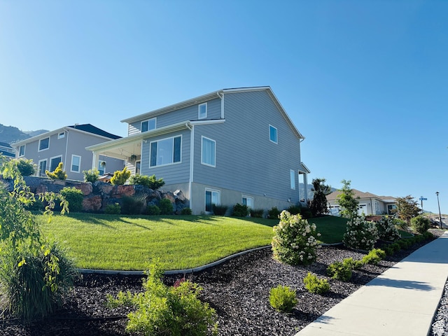611 E 400 N, Providence, UT 84332 - view of side of home featuring a yard