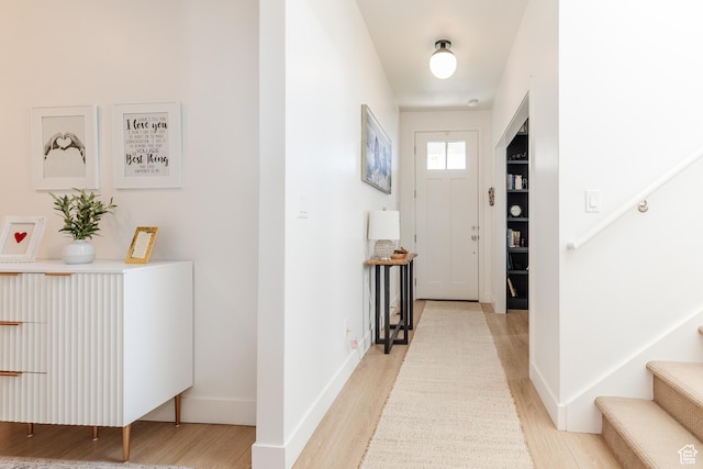 611 E 400 N, Providence, UT 84332 - entryway with light wood finished floors, stairway, and baseboards