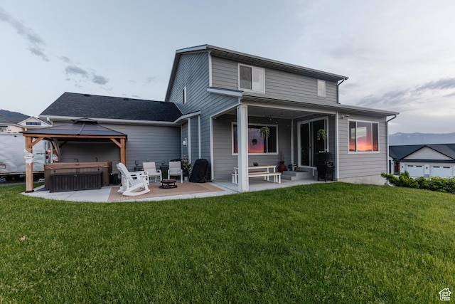611 E 400 N, Providence, UT 84332 - rear view of house with a patio, a gazebo, and a yard