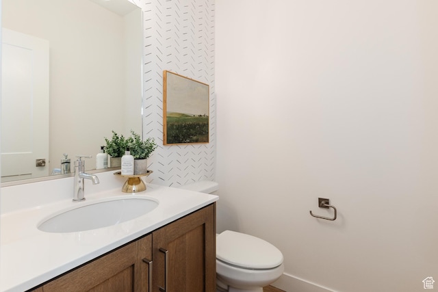 611 E 400 N, Providence, UT 84332 - bathroom with toilet, vanity, and baseboards