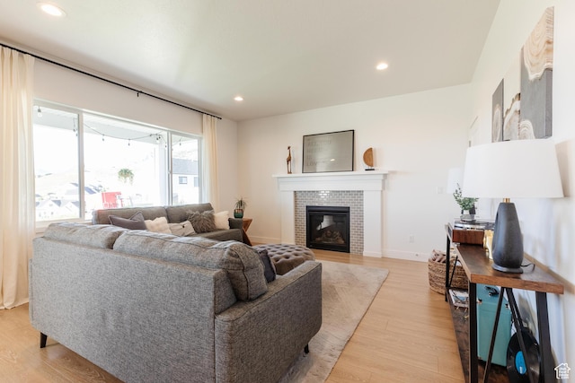 611 E 400 N, Providence, UT 84332 - living area with light wood-type flooring, recessed lighting, a brick fireplace, and baseboards