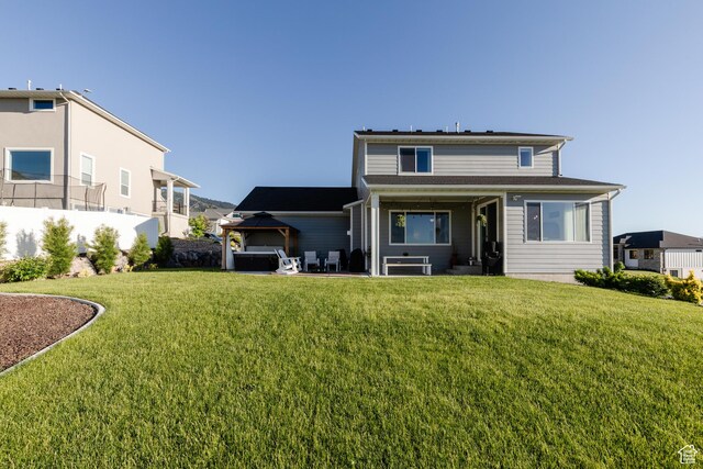 611 E 400 N, Providence, UT 84332 - rear view of house with a gazebo and a hot tub