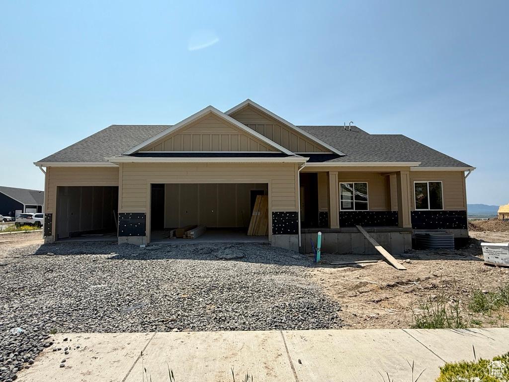 1235 N 1380 E, Logan, UT 84341 - view of front of home with a garage and gravel driveway